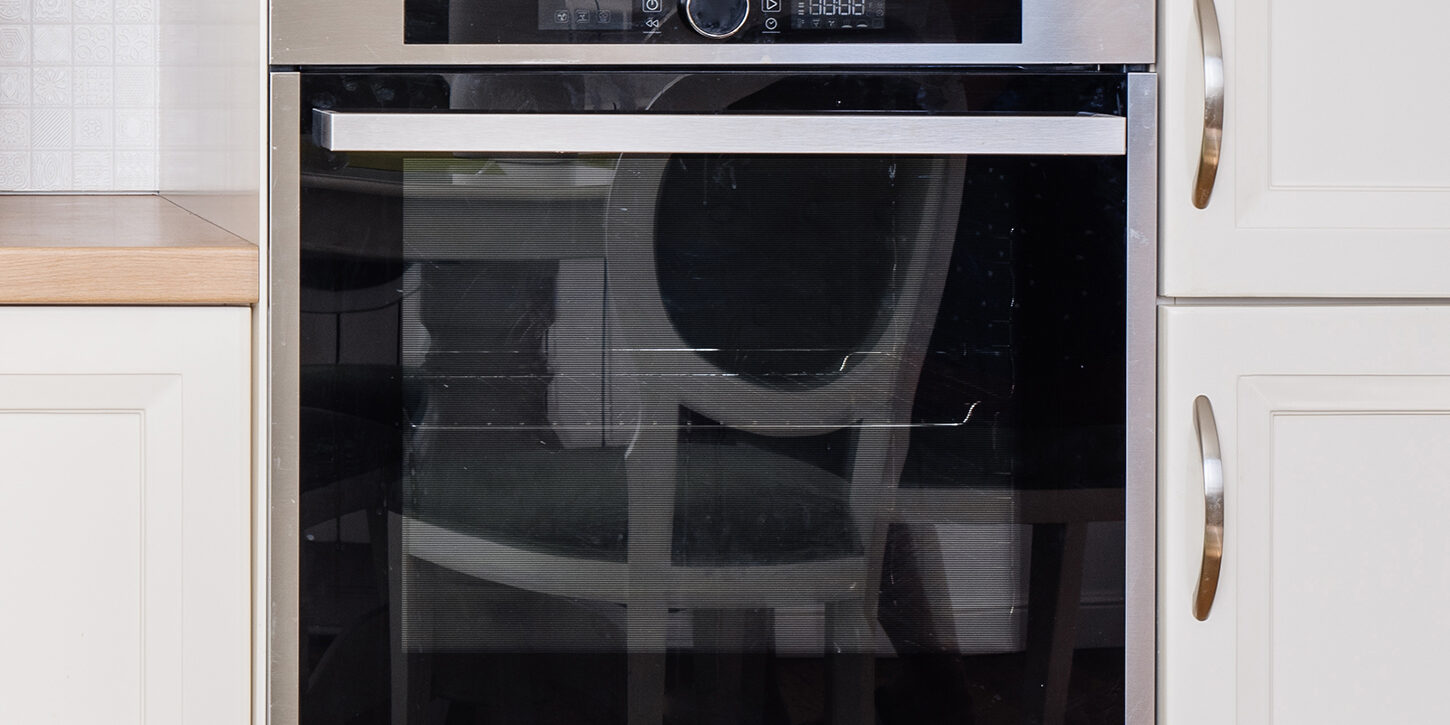 Male Technician Checking Refrigerator