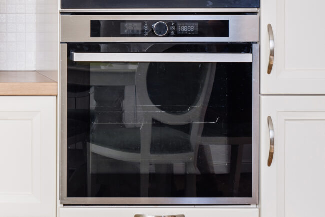 Male Technician Checking Refrigerator